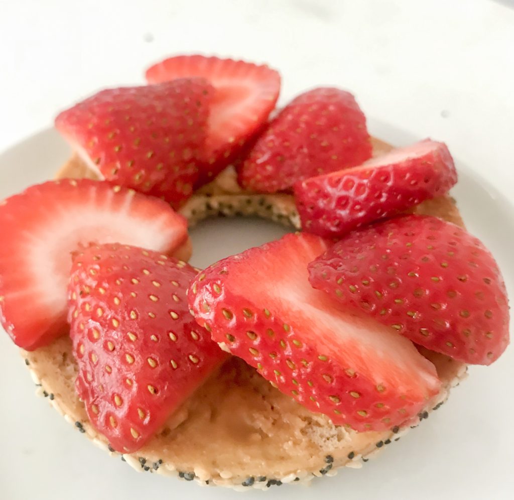 side view bagel with strawberries