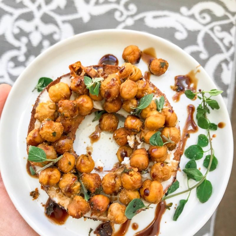 top view bagel with chickpeas and balsamic vinegar